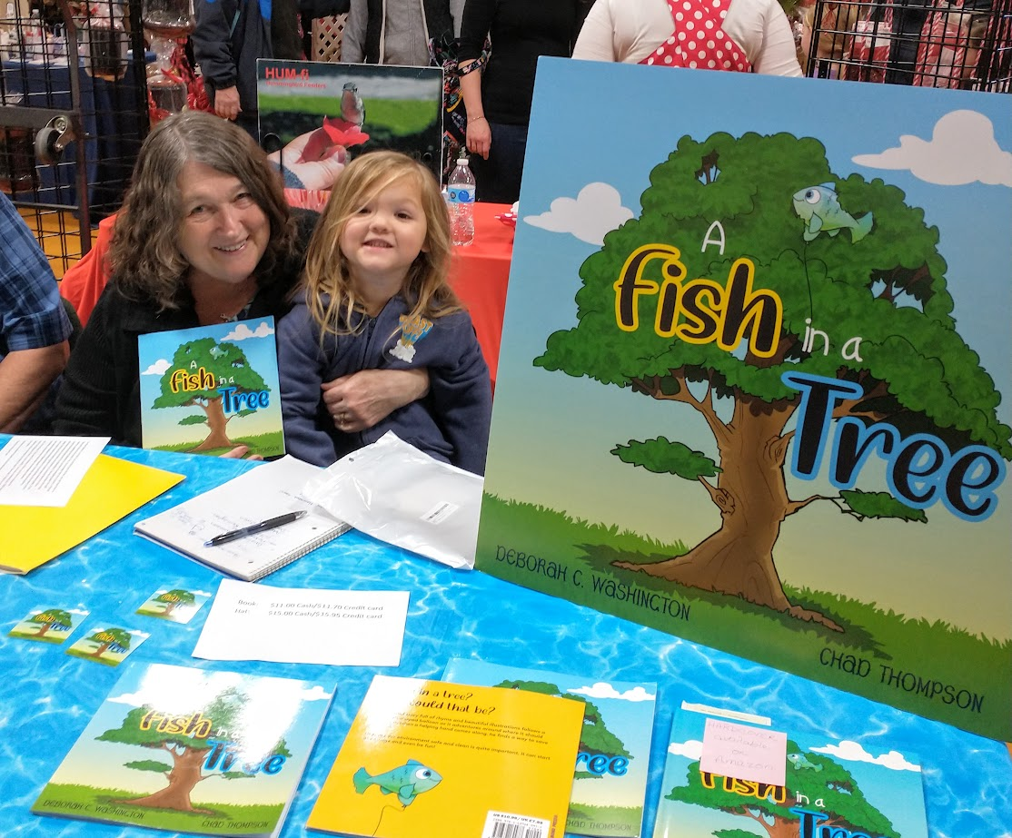 a grandmother and grandson smiling, holding a rhyming children's book